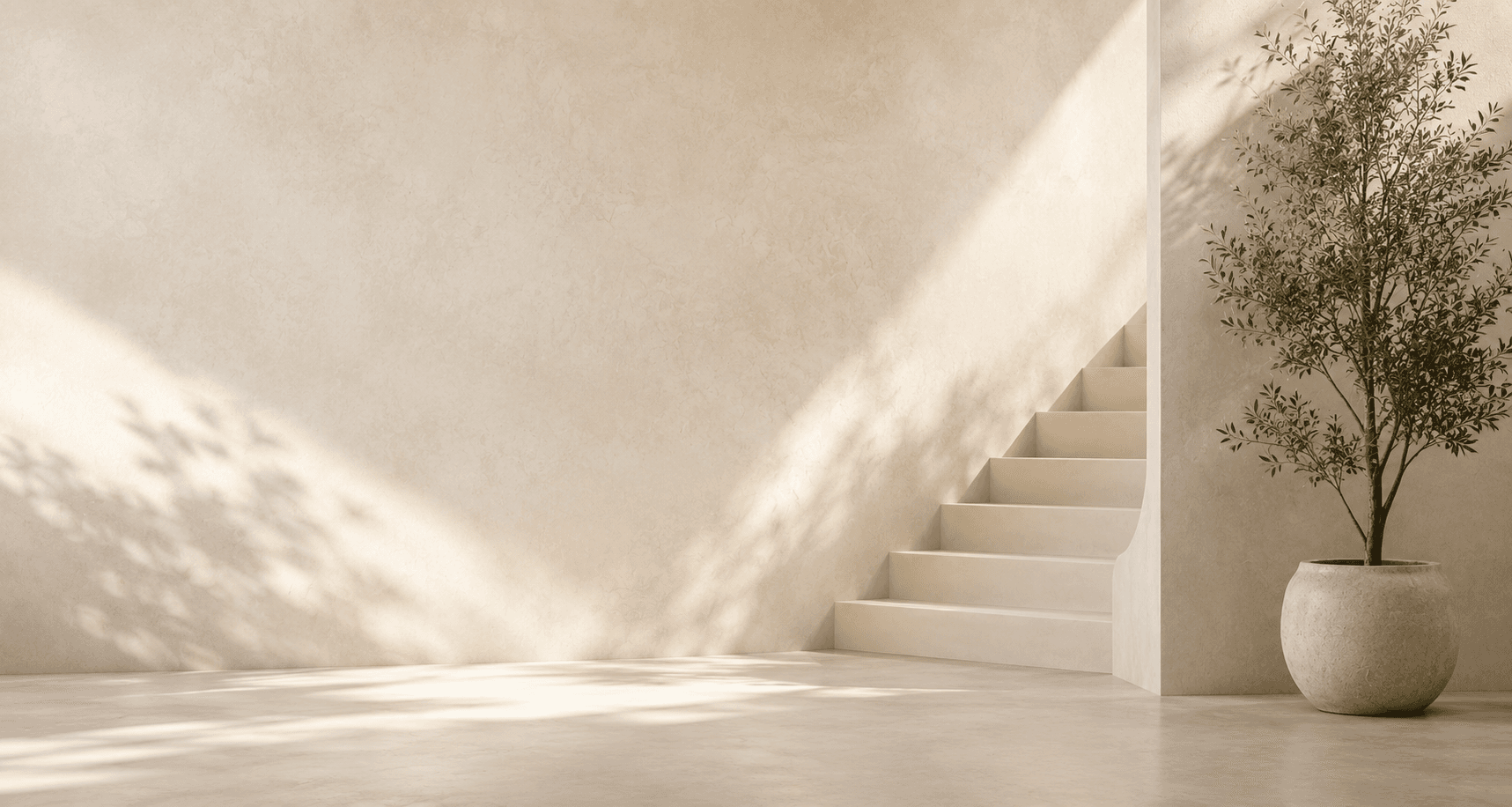 Minimalist interior with seamless microcement surfaces, natural light, and refined furnishings
